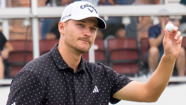 Rasmus Hojgaard reacts after putting on the 18th green during the third round of the Rocket Classic