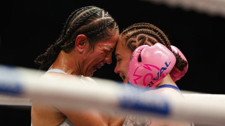 Reina Tellez and Amanda Serrano embrace following their fight 