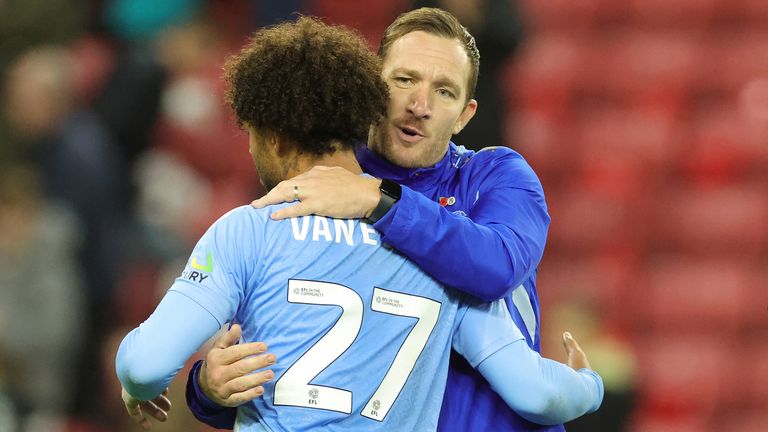 Carr embracing Milan van Ewijk during his time with the Sky Blues