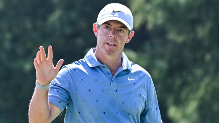 Rory McIlroy of Northern Ireland waves to the crowd after being applauded for sinking a putt and getting a birdie on the 7th hole during the