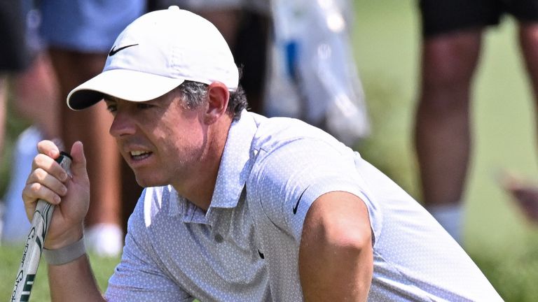 Rory McIlroy of Northern Ireland lines up his putt on the first green during the third round of the PGA BMW Championship