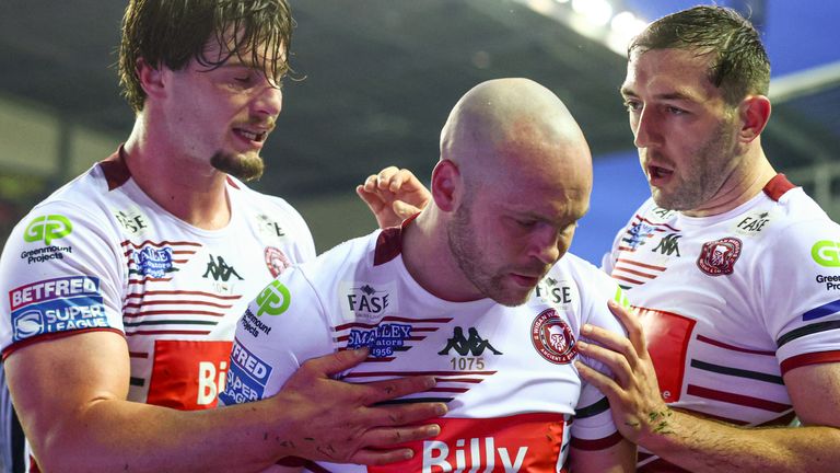 Wigan Warriors' Liam Marshall is congratulated after scoring the first try (SWpix.com image)
