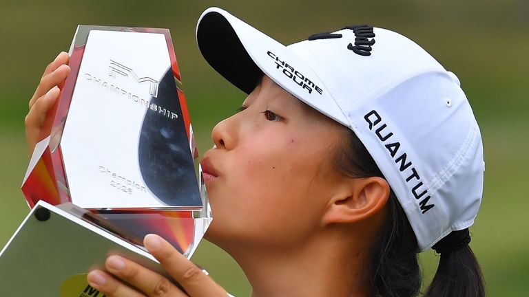 Ruoning Yin, of China, kisses the FM Championship trophy
