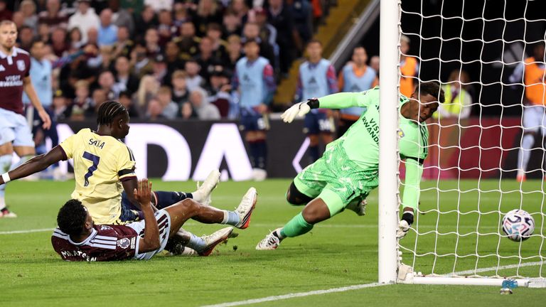 Arsenal's Bukayo Saka slides in a goal at Aston Villa
