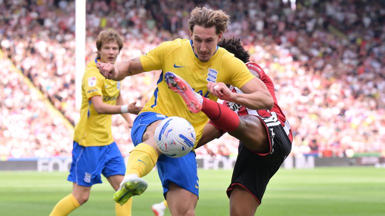 Sheffield United's Sam McCallum challenges Birmingham City's Phil Neumann