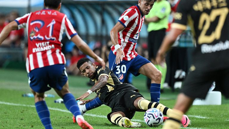 Manchester City's Savinho slides in against Atletico Madrid