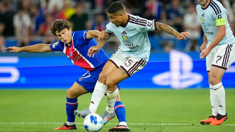 PSG's Joao Neves challenges for the ball with Aston Villa's Joao Gomes (AP Photo/Darko Bandic)
