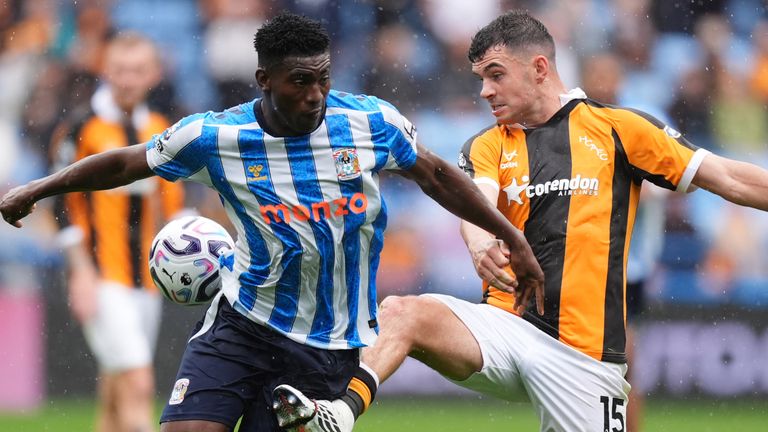 Coventry City's Taiwo Awoniyi and Hull City's John Egan (right) battle for the ball