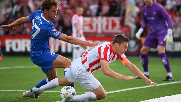 Tromso's Ruben Yttergard Jenssen is challenged by Brighton's Mats Wieffer