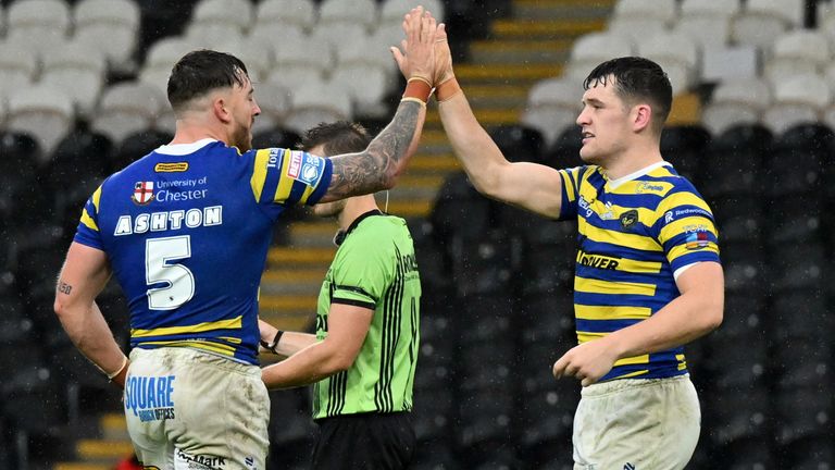Warrington's Matty Ashton and Josh Thewlis celebrate victory over Hull FC