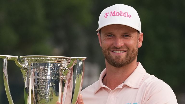 Wyndham Clark holds the Wanamaker Trophy after winning the BMW Championship golf tournament