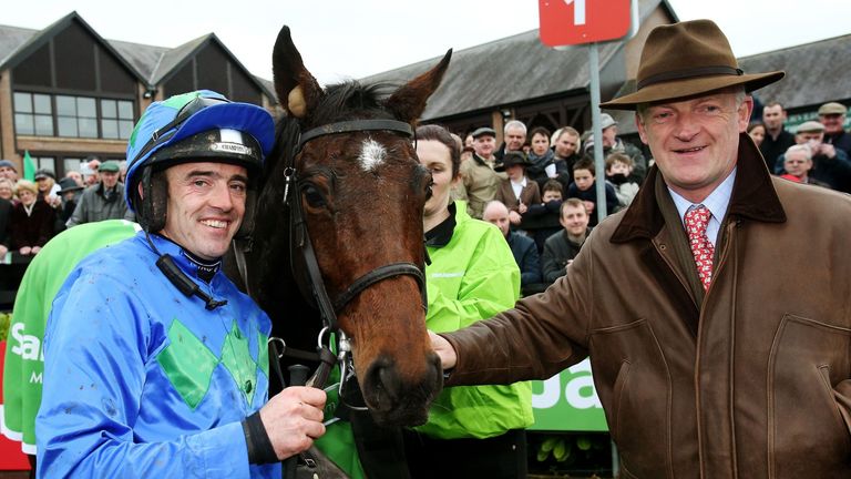 Ruby Walsh and trainer Willie Mullins with Hurricane Fly in the parade ring after winning the Stanjames.com Morgiana Hurdle