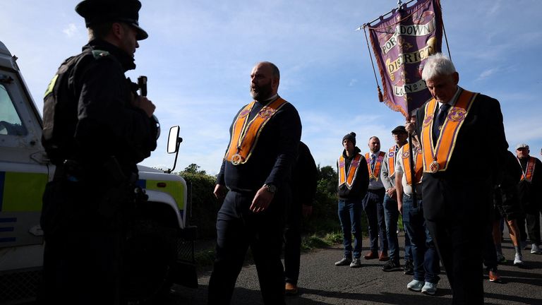 A march of members of the Orange Order is blocked by police near Drumcree Church. Pic: Reuters
