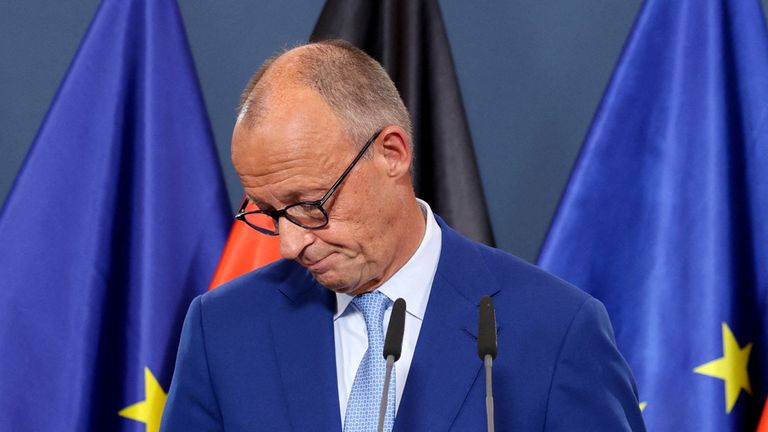 German Chancellor Friedrich Merz reacts after the exit polls. Pic: Reuters