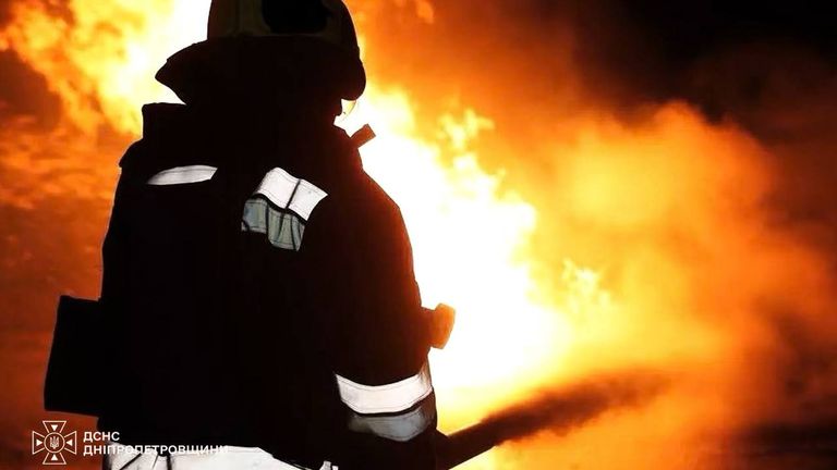 A firefighter in the Dnipropetrovsk region fighting a fire after Russian strikes overnight.
Pic: Ukraine State Emergency Service