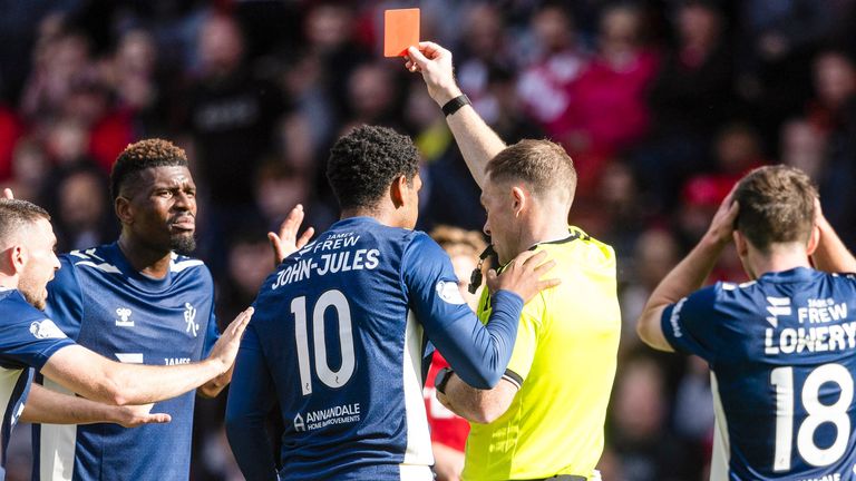  Referee John Beaton shows Kilmarnock's Aaron Tshibola a red card