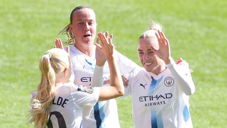 Alex Greenwood celebrates scoring Man City's opener with Laura Blindkilde Brown and Beth Mead