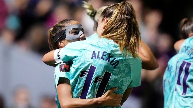 Alexia Putellas celebrates London City's second goal against Man Utd with scorer Danielle van de Donk