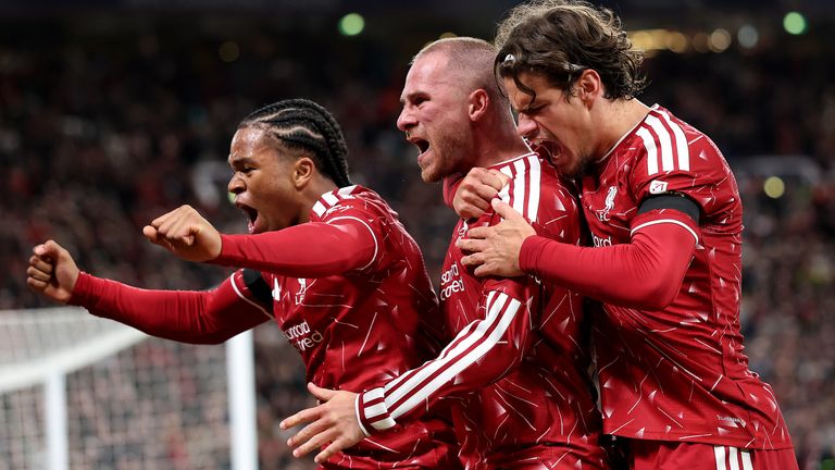 LIVERPOOL, ENGLAND - SEPTEMBER 09: Alexis Mac Allister of Liverpool celebrates scoring his team’s second goal with teammate Rio Ngumoha and 
