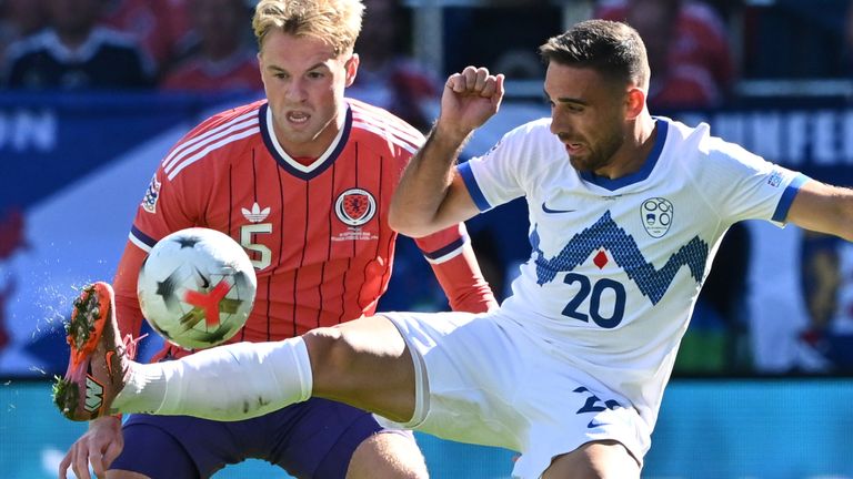 Scotland's Stephen Welsh challenges Slovenia's Aljosa Matko