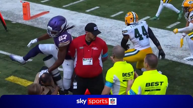 A cameraman was wiped out in the first quarter of Green Bay's NFL clash at Minnesota!