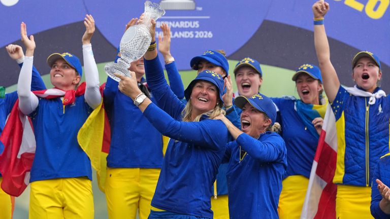 Team Europe captain Anna Nordqvist lifts the Solheim Cup (AP Photo/Alastair Grant)
