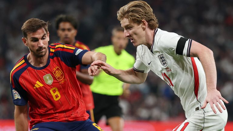 England's Anthony Gordon, right, takes on Spain's Fabian Ruiz during the Nations League Soccer match between England and Spain in London, Saturday, Sept. 26, 2026. (AP Photo/Ian Walton)