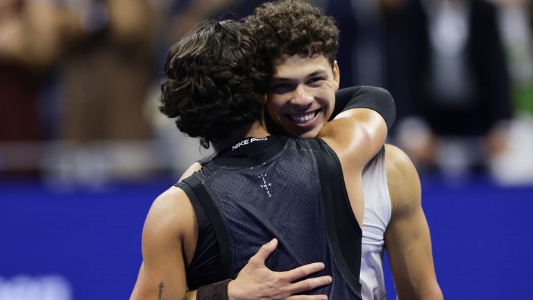 Ben Shelton, right, of the United States, is congratulated by Carlos Alcaraz, of Spain, after winning their match in the quarterfinal round 