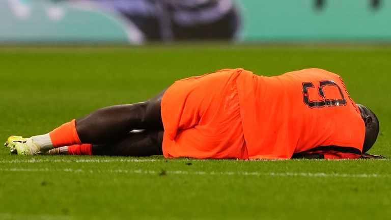 Brian Brobbey, of the Netherlands, lies injured