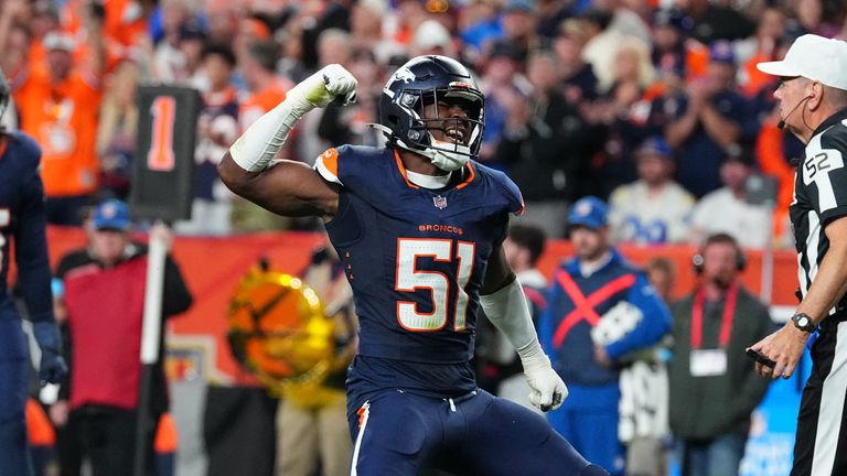 Broncos linebacker Que Robinson (51) celebrates a tackle against the  Rams