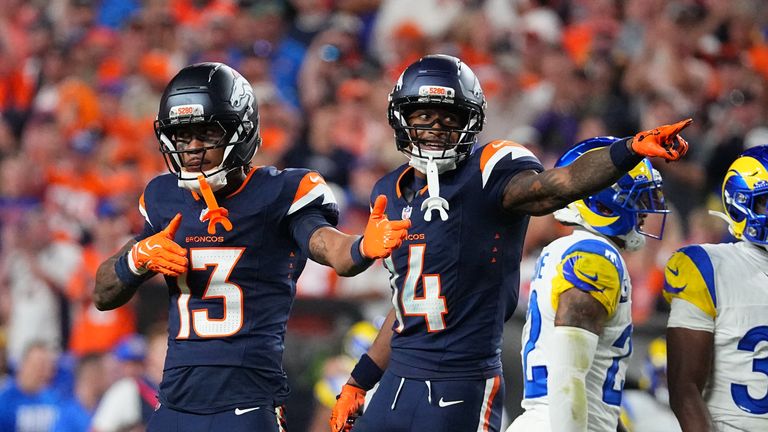 Pat Bryant (13) and Courtland Sutton (14) celebrate a first down