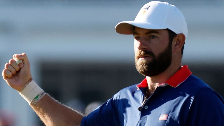 Cameron Young of the United States fist pumps after hitting a putt on No. 4 during the Saturday four ball session of the Presidents Cup