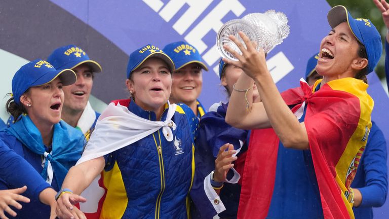 Carlota Ciganda of Europe holds the trophy as she celebrates after Europe won the Solheim Cup