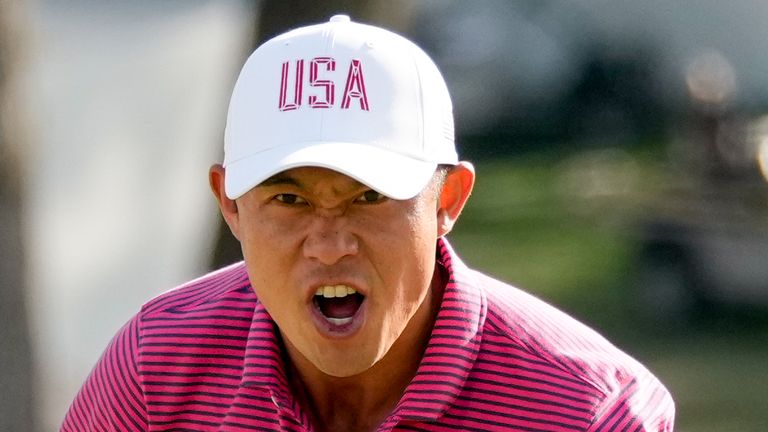USA teams' Collin Morikawa celebrates his win over International teams' Hideki Matsuyama, of Japan, after their Presidents Cup
