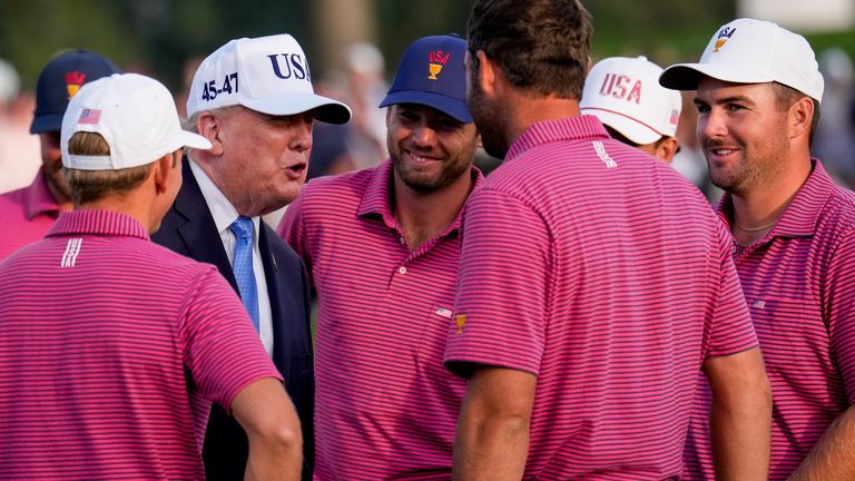 President Donald Trump speaks with Team USA after their dramatic Presidents Cup win