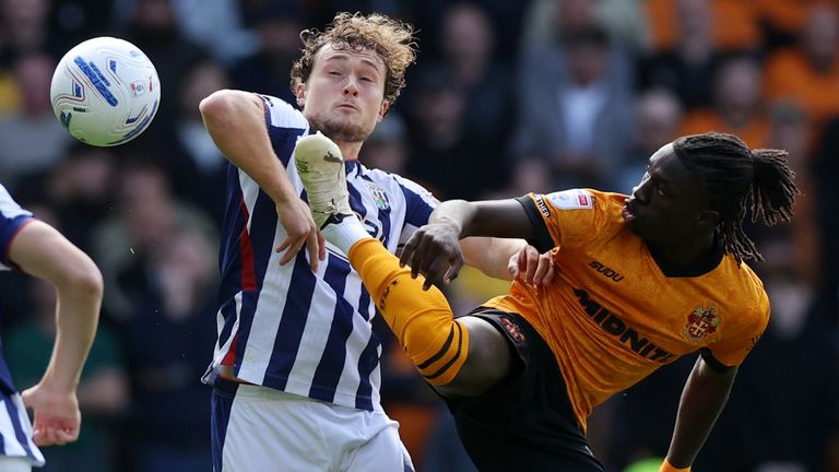 Callum Styles is challenged by Mateus Mane