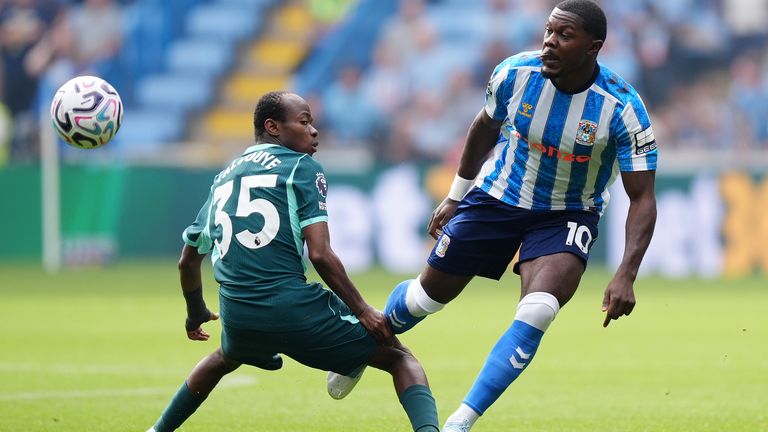 Coventry City's Ephron Mason-Clark and Brighton's Malick Yalcouye compete for the ball