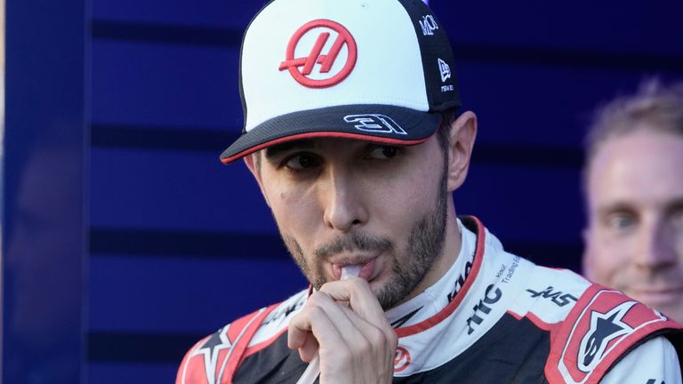Haas driver Esteban Ocon of France walks through the paddock after failing to advance during the qualifying session for the Spanish Formula One Grand Prix in Madrid, Saturday, Sept. 12, 2026. (AP Photo/Bernat Armangue)