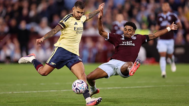 BIRMINGHAM, ENGLAND - AUGUST 31: Bruno Guimaraes of Arsenal shoots under pressure from Ian Maatsen of Aston Villa  during the Premier League 2026/27 match between Aston Villa FC and Arsenal FC at Villa Park on August 31, 2026 in Birmingham, England. (Photo by Naomi Baker/Getty Images)