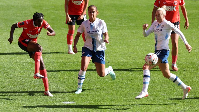 Hawa Cissoko of Charlton clears the ball under pressure from Mary Fowler and Alex Greenwood