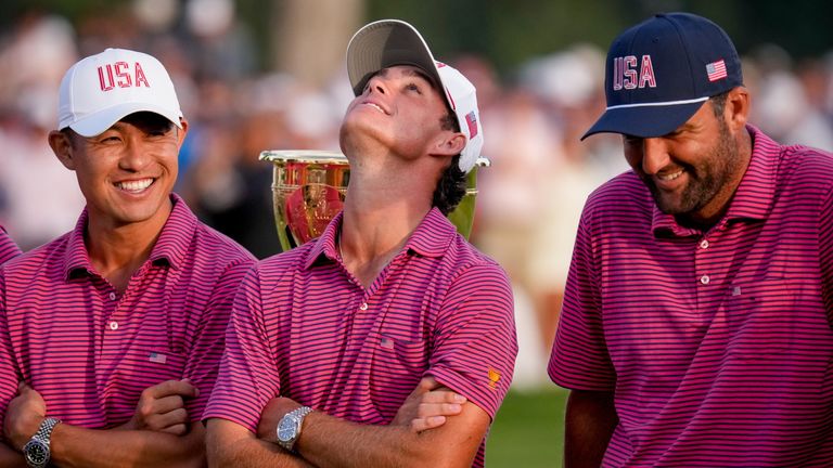 ackson Koivun, center, Collin Morikawaand Scottie Scheffler celebrate after their win over the International team in the Presidents Cup 