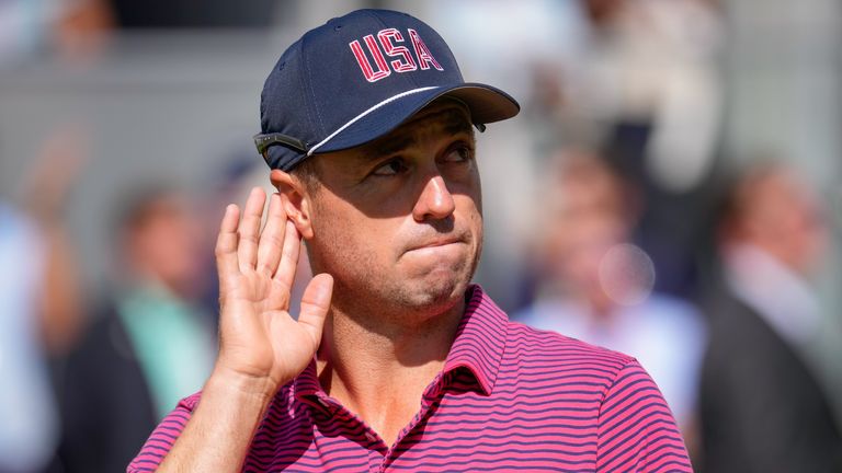 USA teams' Justin Thomas motions to the fans prior to the start of the Presidents Cup golf tournament final round singles match 