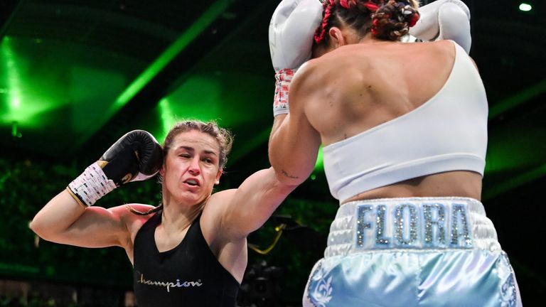 Katie Taylor, left, and Flora Pili during their undisputed super lightweight championship fight