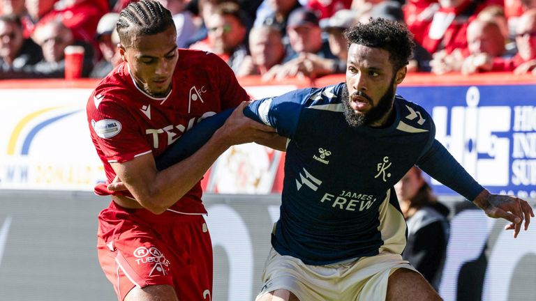 Kilmarnock's Djenairo Daniels (R) and Aberdeen's Nesta Guinness-Walker battle for possession