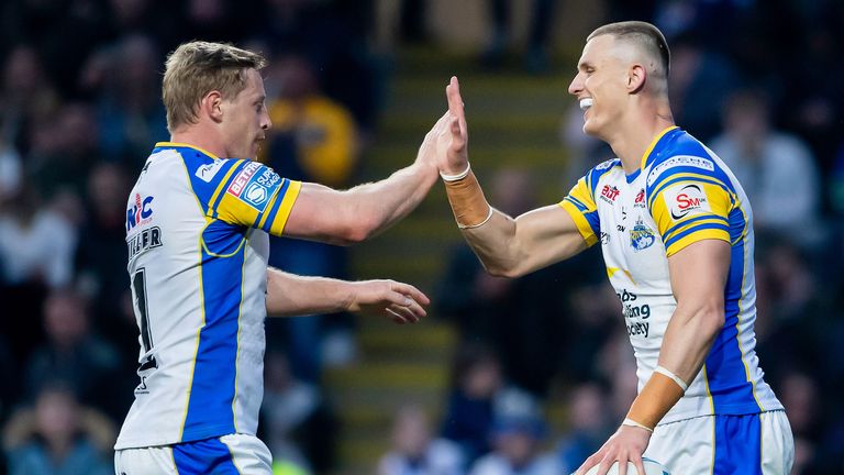 Picture by Allan McKenzie/SWpix.com - 03/05/2024 - Rugby League - Betfred Super League Round 10 - Leeds Rhinos v London Broncos - AMT Headingley, Leeds, England - Leeds' Ash Handley (r) is congratulated on his try against London by Lachie Miller.