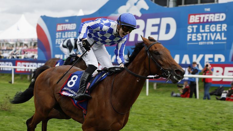 Saffie Osborne roars as she becomes the first female jockey to win a British Classic aboard Highwayman in the Leger at Doncaster.