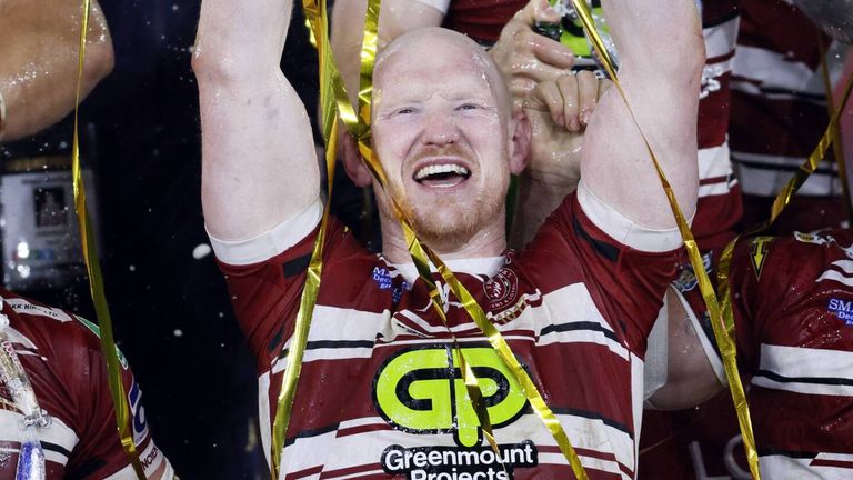 Liam Farrell celebrates with the Super League Grand Final trophy in 2024