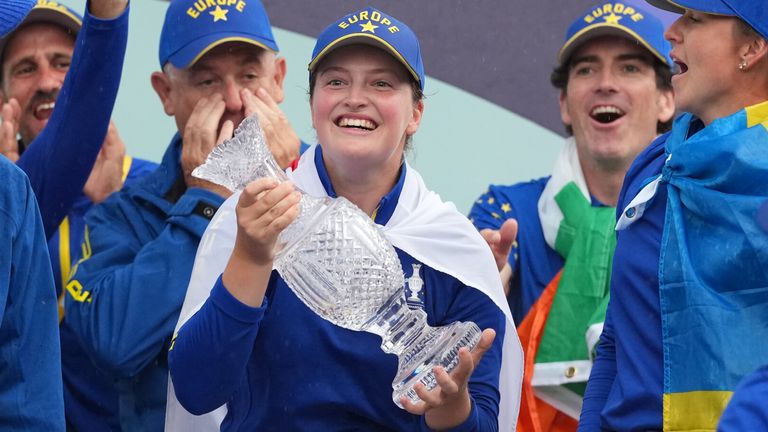 Lottie Woad of Europe holds the Solheim Cup (AP Photo/Alastair Grant)