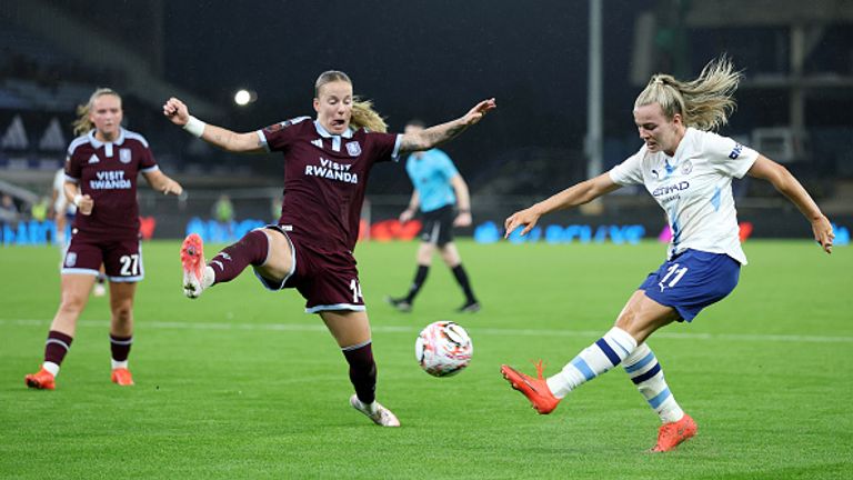 BIRMINGHAM, ENGLAND - SEPTEMBER 13: Lauren Hemp of Manchester City crosses the ball under pressure from Lynn Wilms of Aston Villa during the Barclays Women's Super League 2026/27 match between Aston Villa FC and Manchester City at Villa Park on September 13, 2026 in Birmingham, England. (Photo by Dan Istitene/Getty Images)
