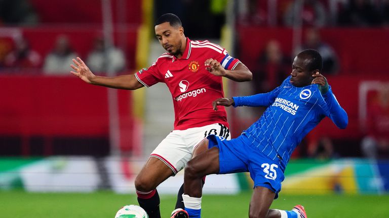 Youri Tielemans challenges Malick Yalcouye for the ball